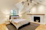 Master bedroom with hearth with a salvaged wood mantel. – Remodel in a Tudor-style home: Morning Light Master – Board & Vellum